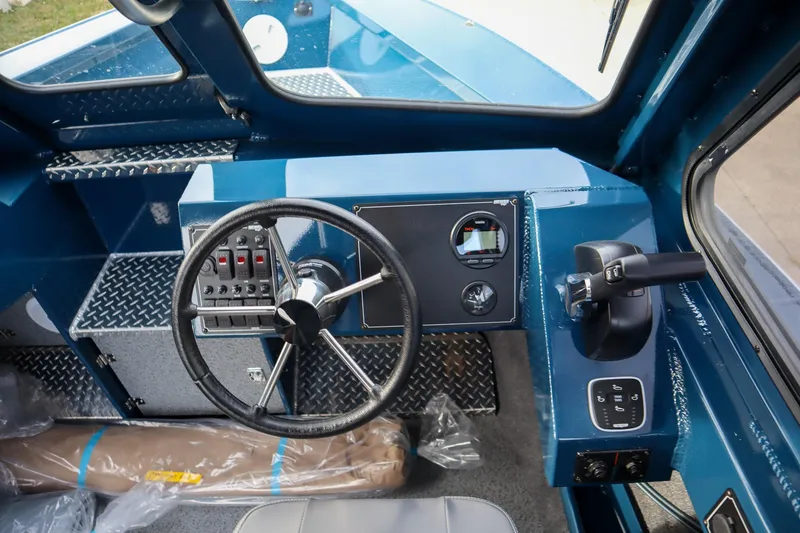 Slide: The Image of Interior view of 2026 Hewescraft 240 Ocean Pro ET HT boat dashboard and controls. - 13