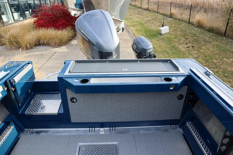 Slide: The Image of 2026 Hewescraft 240 Ocean Pro ET HT boat deck with dual outboard motors. - 5