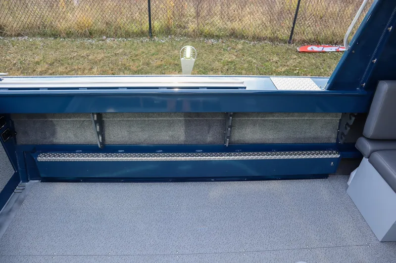 Slide: The Image of Interior view of 2026 Hewescraft 240 Ocean Pro ET HT boat, featuring seating and storage. - 6