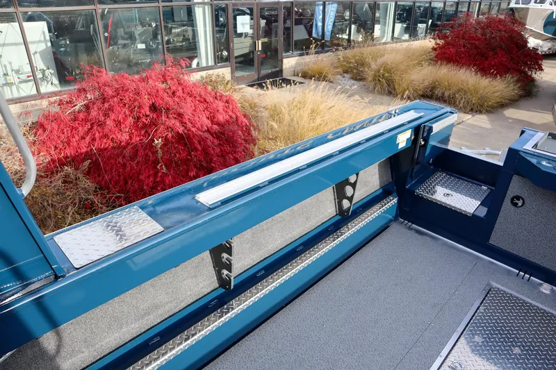 Slide: The Image of 2026 Hewescraft 240 Ocean Pro ET HT boat interior with red foliage background. - 7