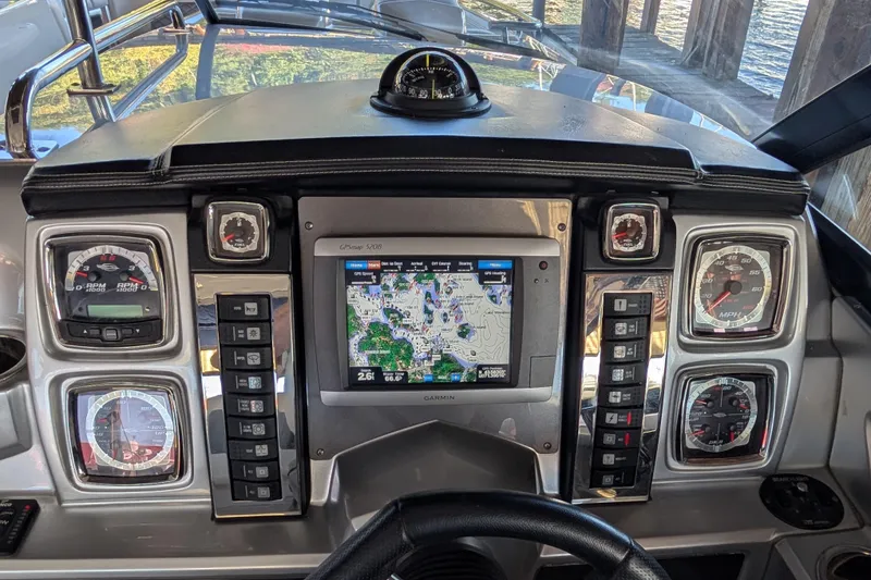 Slide: The Image of Dashboard of a 2012 Chaparral 327 SSX boat with GPS and gauges. - 14