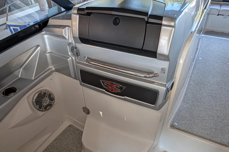Slide: The Image of Interior of 2012 Chaparral 327 SSX boat, featuring sleek design and speaker system. - 15