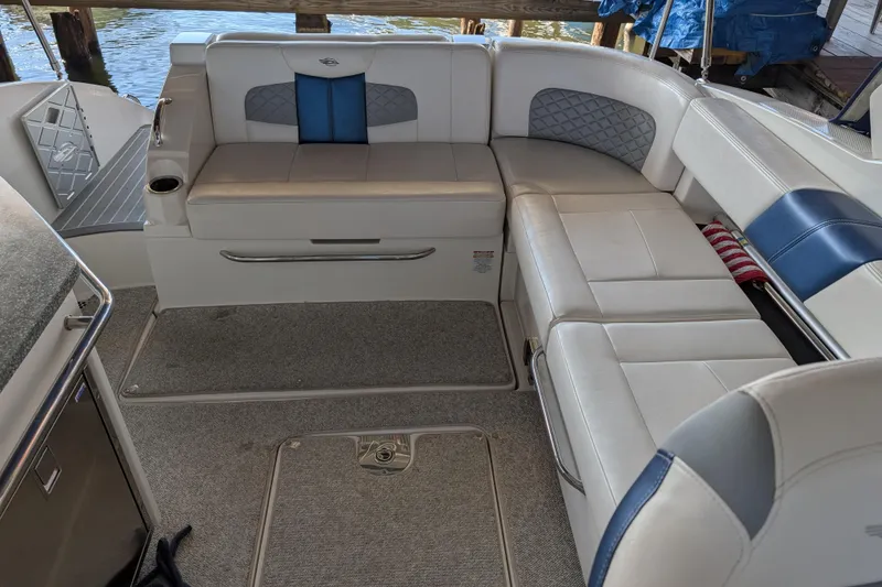 Slide: The Image of Interior of 2012 Chaparral 327 SSX boat with white and blue seating. - 25