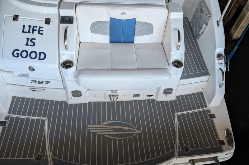 Slide: The Image of 2012 Chaparral 327 SSX boat interior with "Life is Good" text and seating area. - 29