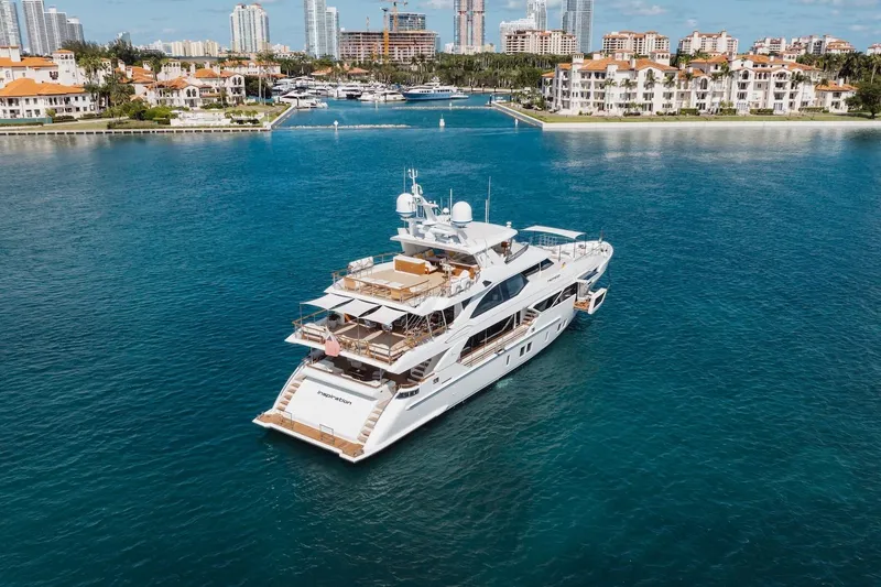 Slide: The Image of Luxurious 2018 Benetti Fast 125 yacht cruising near coastal cityscape. - 2