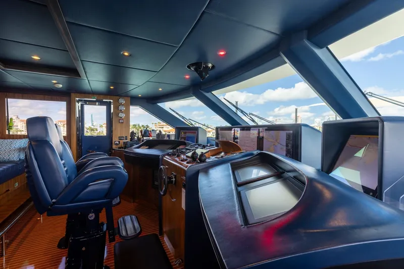 Slide: The Image of Bridge interior of 2018 Benetti Fast 125 yacht with modern navigation equipment and blue seating. - 34