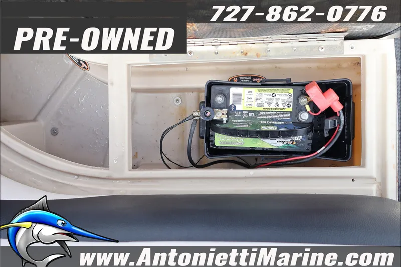 Slide: The Image of Pre-owned 2012 Harris FloteBote Cruiser CX 200 battery compartment, contact Antonietti Marine. - 19