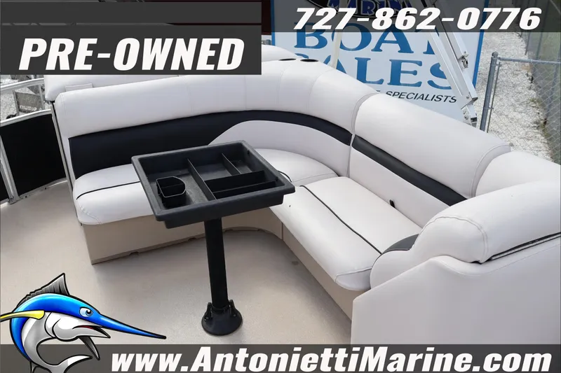 Slide: The Image of Pre-owned 2012 Harris FloteBote Cruiser CX 200 with white seating and table, for sale. - 8