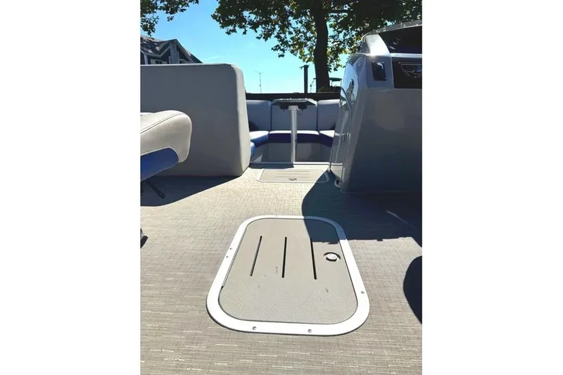 Slide: The Image of 2022 Bennington 23 LTFB boat interior with seating and storage hatch. - 14