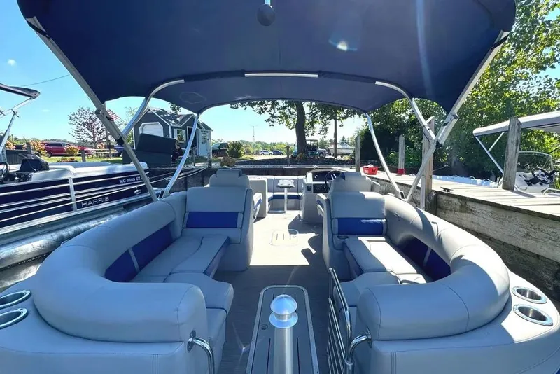 Slide: The Image of 2022 Bennington 23 LTFB pontoon boat with spacious seating and canopy. - 25