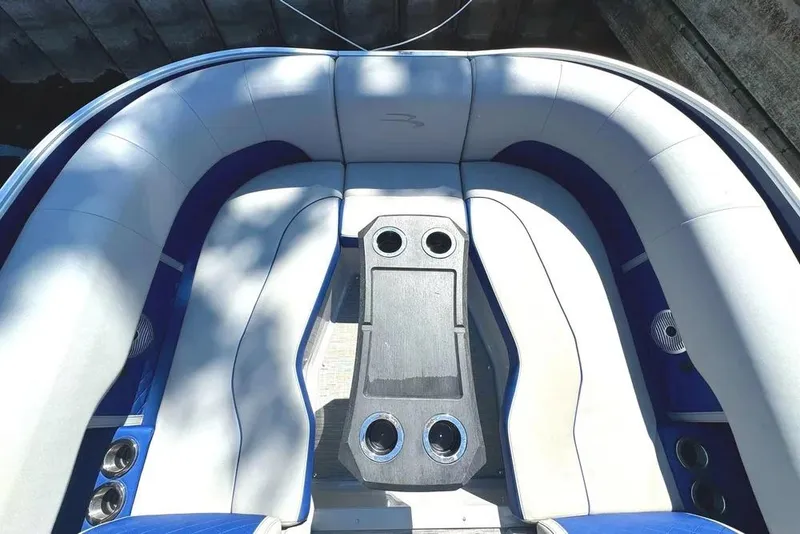 Slide: The Image of 2022 Bennington 23 LTFB boat interior with cushioned seating and cup holders. - 6
