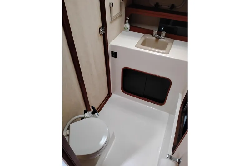 Slide: The Image of Bathroom interior of 1990 Bayliner 3888 Motoryacht with sink and toilet. - 35