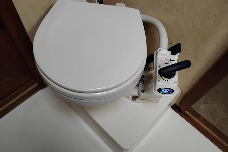 Slide: The Image of Marine toilet in 1990 Bayliner 3888 Motoryacht bathroom, featuring Jabsco manual pump. - 37