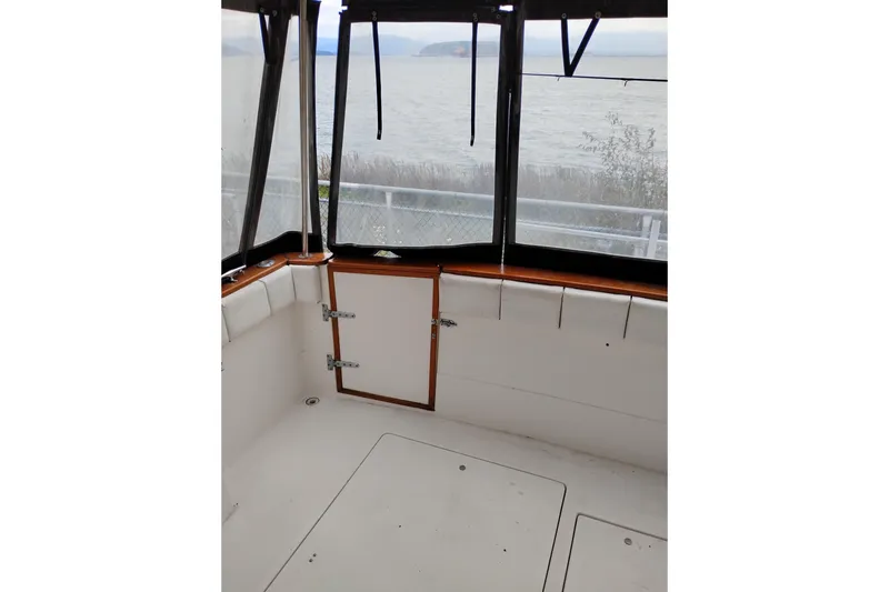 Slide: The Image of 1990 Bayliner 3888 Motoryacht interior with ocean view through windows. - 4