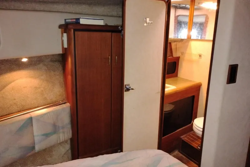 Slide: The Image of 1990 Bayliner 3888 Motoryacht interior with cozy cabin and bathroom. - 41