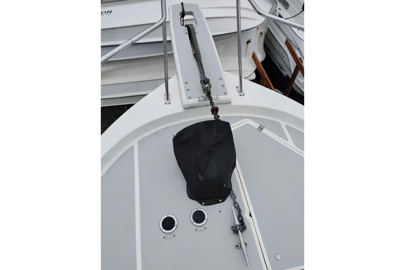 Slide: The Image of 1990 Bayliner 3888 Motoryacht deck with anchor and fittings. - 57