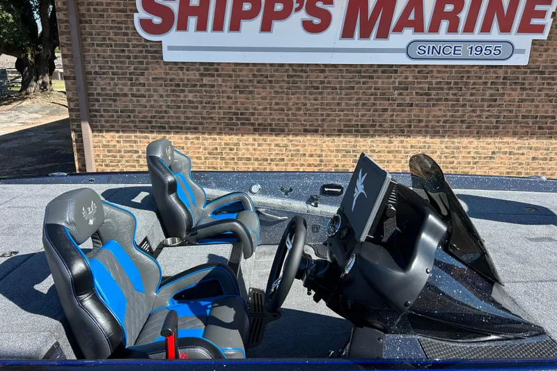 Slide: The Image of 2026 Phoenix 721 ZXL boat interior with blue and black seats at Shipp's Marine. - 6