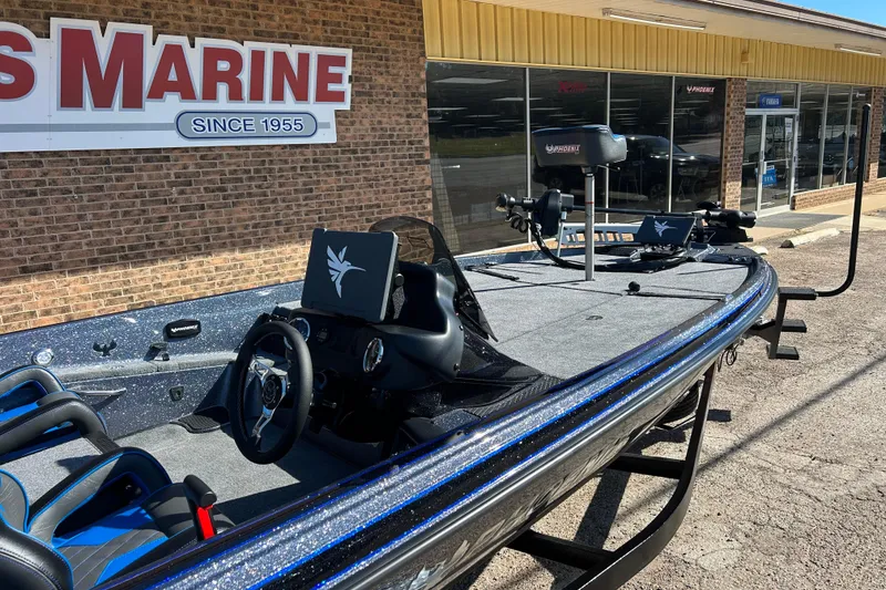 Slide: The Image of 2026 Phoenix 721 ZXL boat displayed outside a marine dealership. - 7