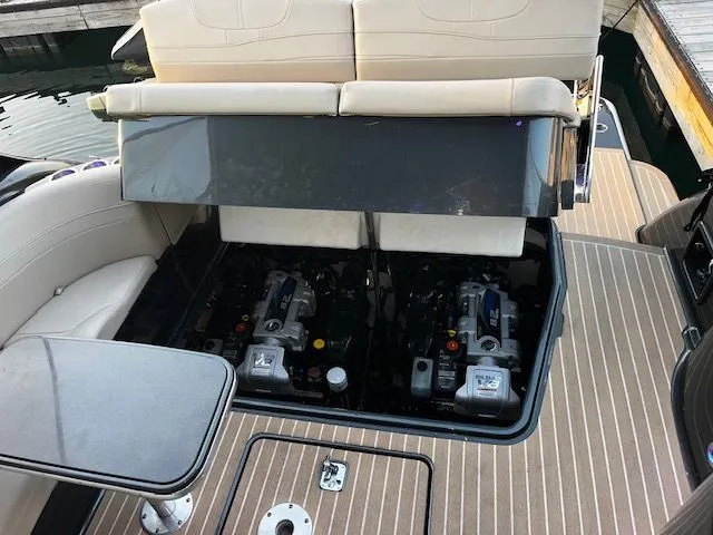 Slide: The Image of 2018 Formula 37 Performance Cruiser engine compartment with twin engines, open seating, and teak deck. - 13