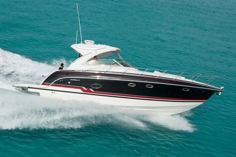 Slide: The Image of 2019 Formula 37 Performance Cruiser speeding on turquoise water. - 15