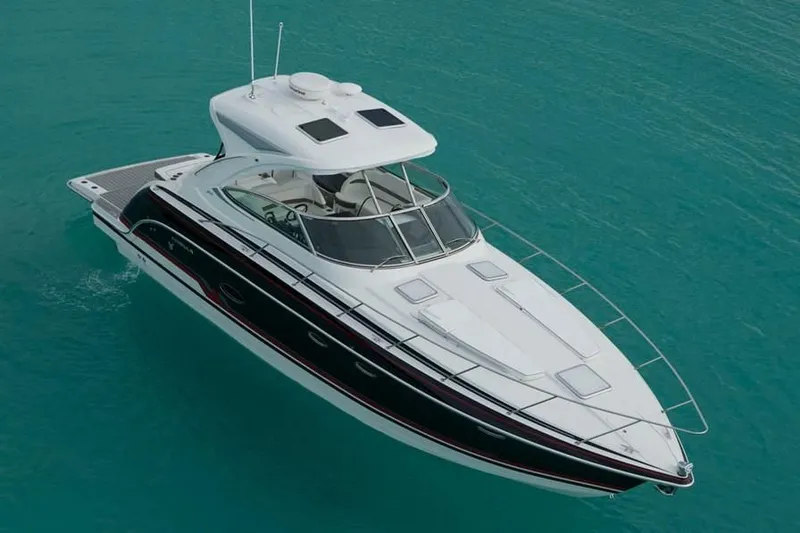 Slide: The Image of 2019 Formula 37 Performance Cruiser on turquoise water. - 16