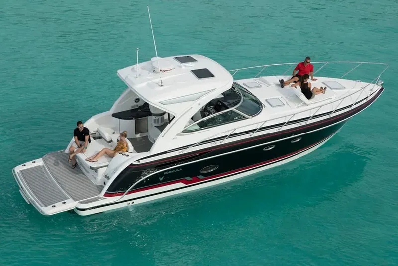 Slide: The Image of 2019 Formula 37 Performance Cruiser on turquoise water with people relaxing. - 17