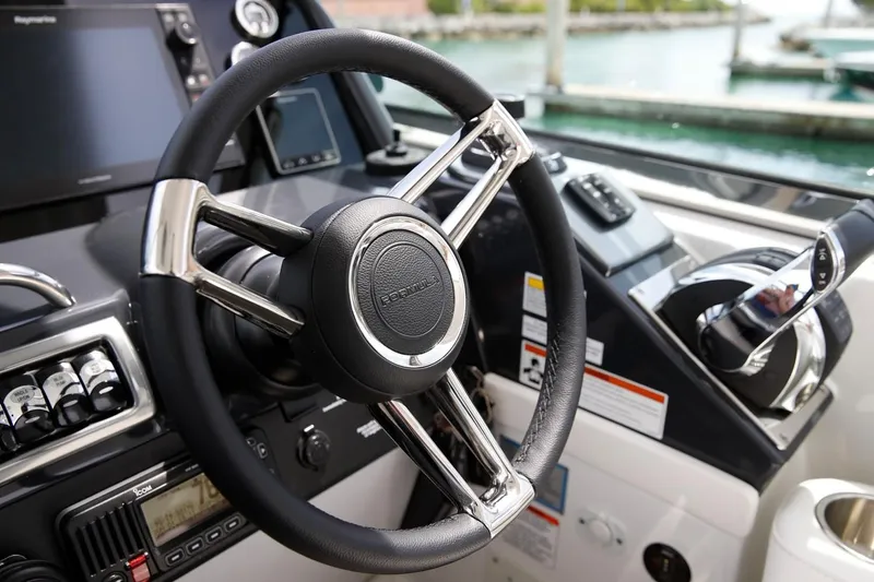 Slide: The Image of 2019 Formula 37 Performance Cruiser helm with steering wheel and control panel. - 20