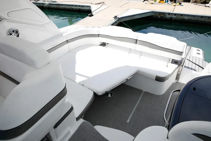 Slide: The Image of 2019 Formula 37 Performance Cruiser, spacious white seating area by the dock. - 23