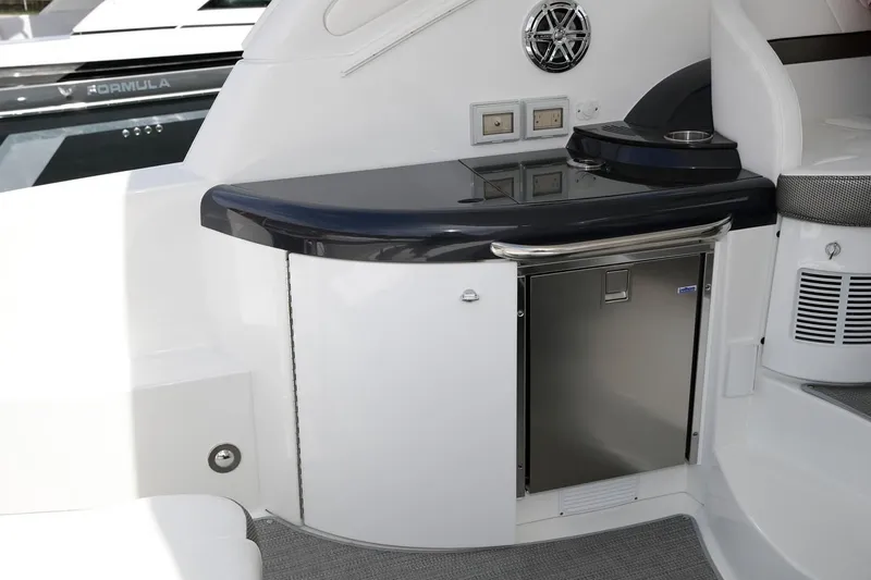 Slide: The Image of 2019 Formula 37 Performance Cruiser interior with mini fridge and counter. - 24