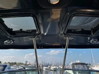 Slide: The Image of 2018 Formula 37 Performance Cruiser interior with open sunroof, docked at marina. - 4