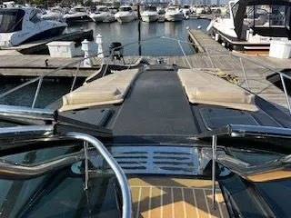 Slide: The Image of 2018 Formula 37 Performance Cruiser docked at a marina with other boats. - 8