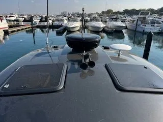Slide: The Image of 2018 Formula 37 Performance Cruiser docked in a marina with other boats. - 9
