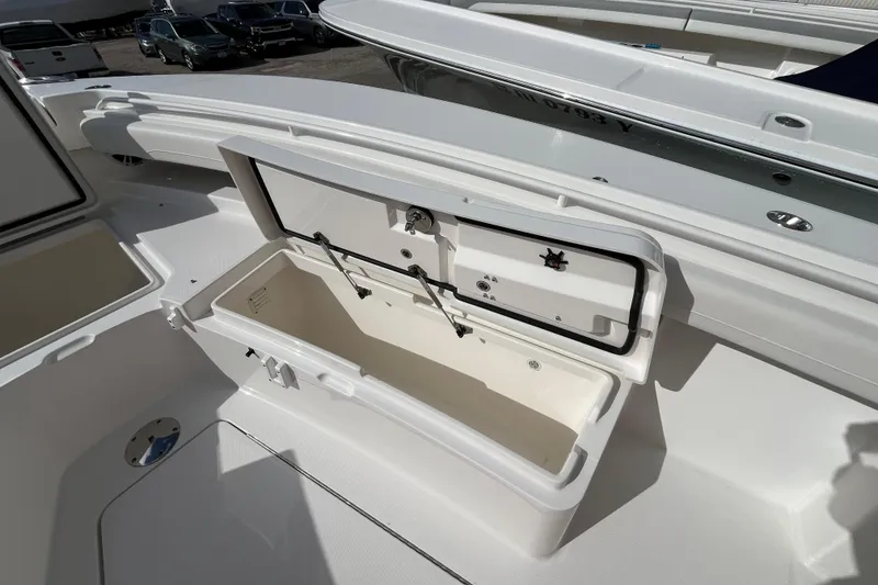 Slide: The Image of Open storage compartment on 2023 Regulator 28 boat, showcasing spacious interior design. - 10