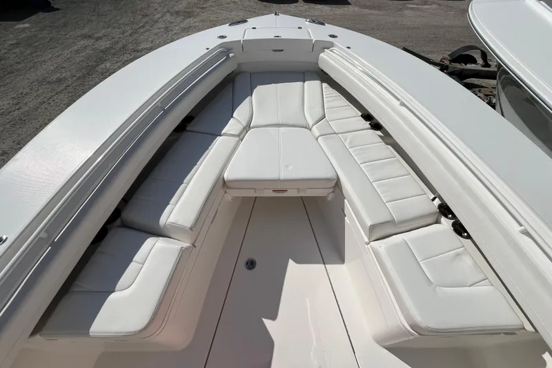 Slide: The Image of 2023 Regulator 28 boat with spacious white seating area. - 12