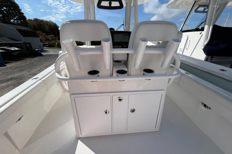 Slide: The Image of 2023 Regulator 28 boat interior with rod holders and storage compartments. - 40