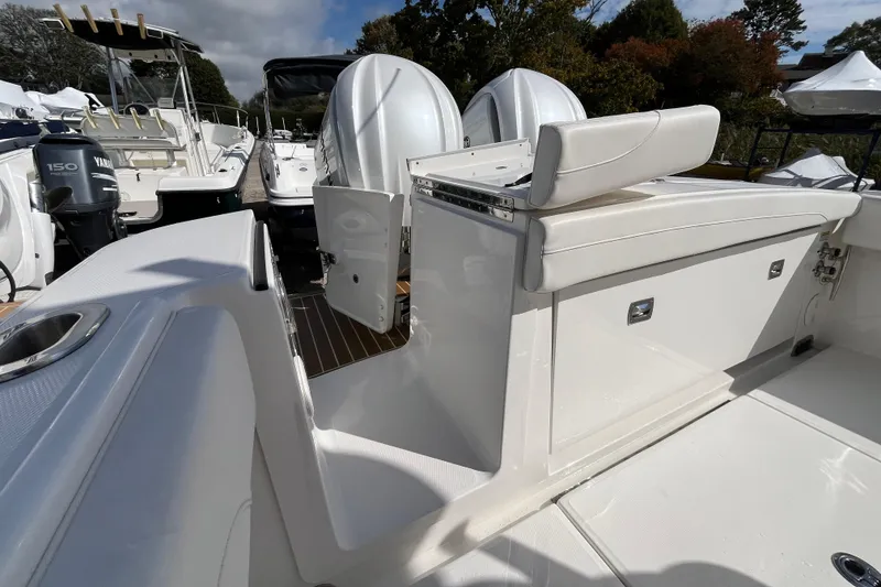Slide: The Image of 2023 Regulator 28 boat interior with seating and engine view. - 45