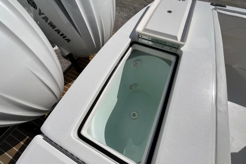 Slide: The Image of 2023 Regulator 28 boat with Yamaha engines and built-in storage compartment. - 47