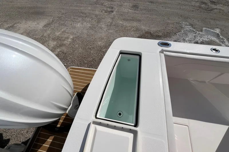 Slide: The Image of 2023 Regulator 28 boat stern with engine and storage compartments. - 48