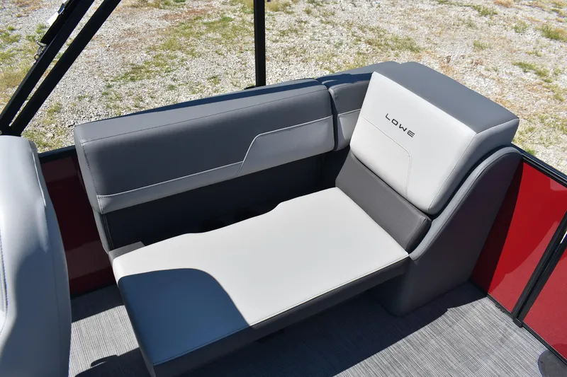 Slide: The Image of 2025 Lowe LS 210 WT boat seat with gray upholstery and logo detail. - 16
