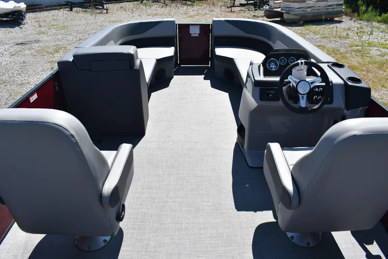 Slide: The Image of 2025 Lowe LS 210 WT boat interior with gray seating and modern dashboard. - 18