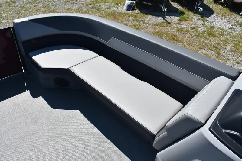Slide: The Image of 2025 Lowe LS 210 WT boat interior with gray cushioned seating. - 8