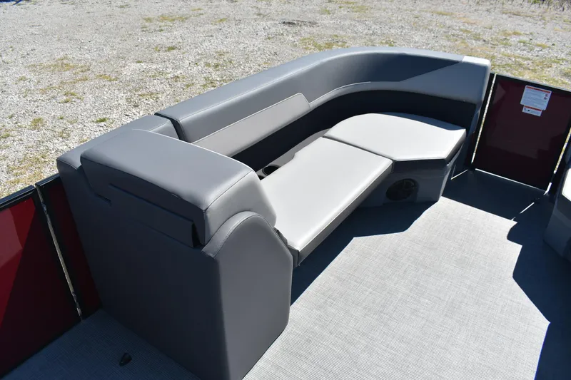 Slide: The Image of 2025 Lowe LS 210 WT boat interior with gray seating and carpeted floor. - 9