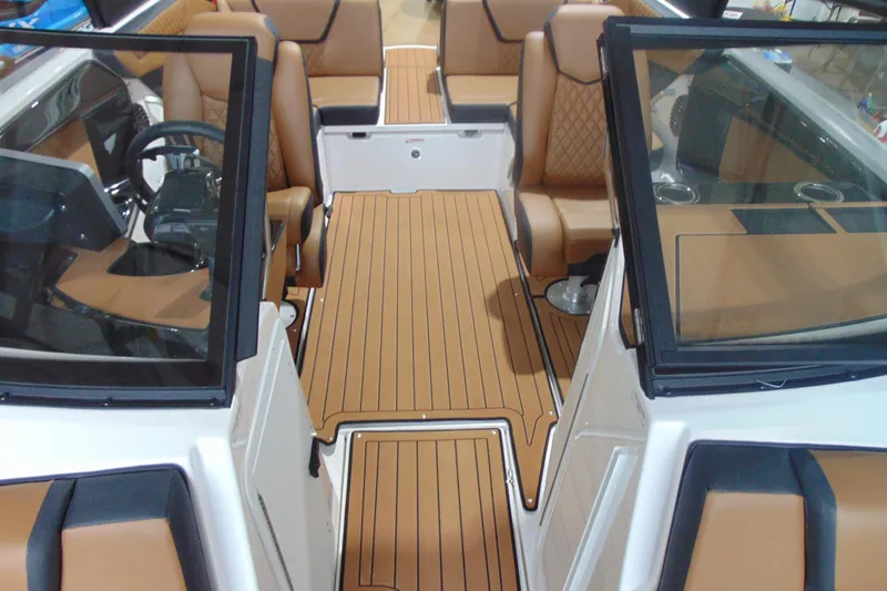 Slide: The Image of 2026 Yamaha Boats 222SE interior with luxurious tan seating and sleek design. - 9