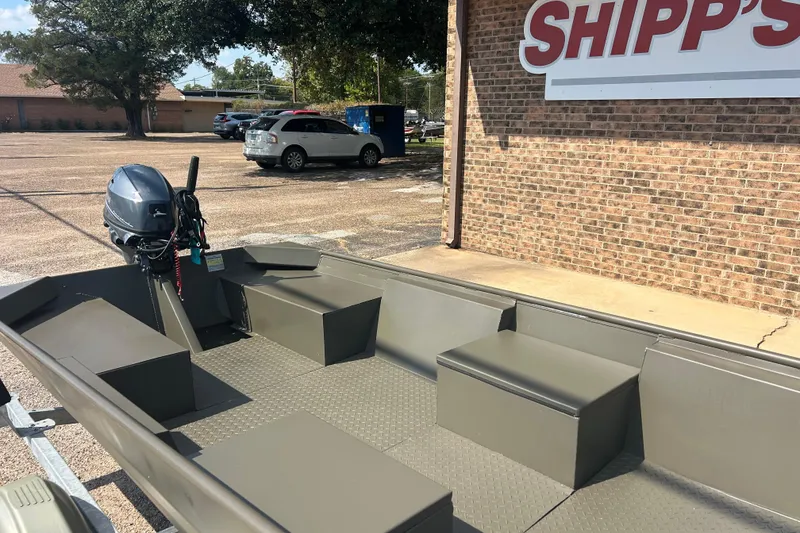 Slide: The Image of 2025 WeldBilt 1652 boat with motor, parked outside Shipp's store. - 3