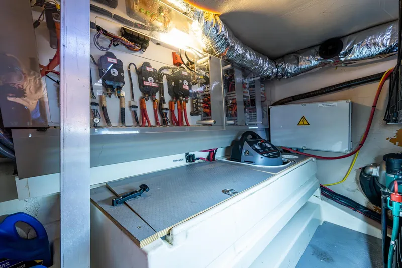 Slide: The Image of Engine room of 2012 Prestige Flybridge yacht with electrical components and wiring. - 100