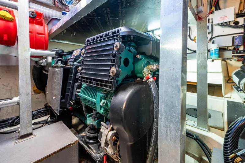 Slide: The Image of Engine room of 2012 Prestige Flybridge yacht, showcasing mechanical components and wiring. - 103