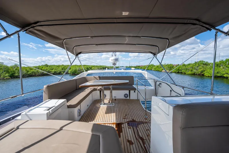 Slide: The Image of Luxurious 2012 Prestige Flybridge yacht with spacious deck and scenic waterway view. - 32