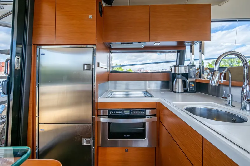 Slide: The Image of Modern kitchen interior on 2012 Prestige Flybridge yacht with stainless steel appliances. - 41