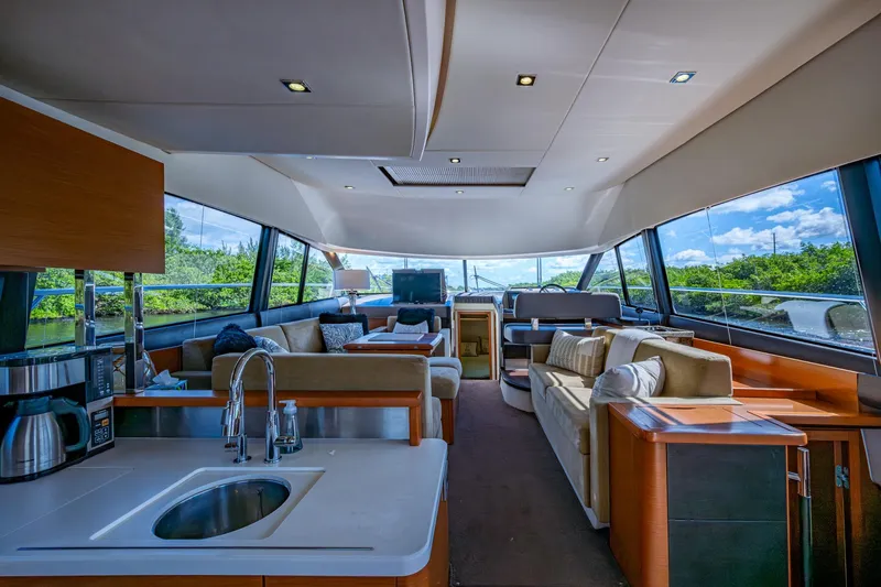 Slide: The Image of Luxurious interior of a 2012 Prestige Flybridge yacht with modern amenities and panoramic windows. - 56
