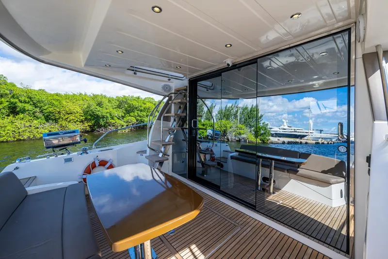 Slide: The Image of Luxurious 2012 Prestige Flybridge yacht interior with sleek design and scenic waterfront view. - 60